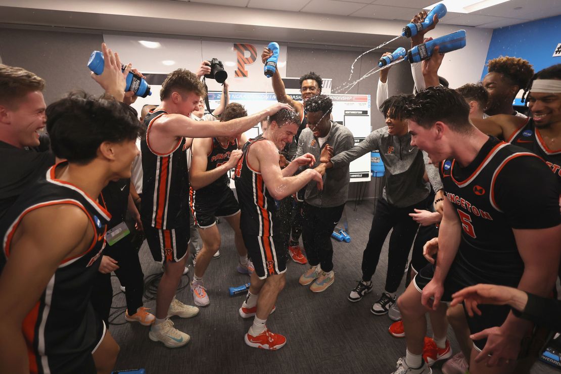 Princeton Tigers players celebrate in the locker room after a win against Missouri during the second round of the 2023 NCAA Men's Basketball Tournament held at Golden 1 Center on March 18, 2023 in Sacramento, California. 