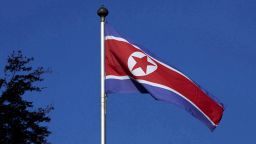 FILE PHOTO: A North Korean flag flies on a mast at the Permanent Mission of North Korea in Geneva October 2, 2014.  REUTERS/Denis Balibouse/File Photo