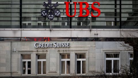A sign of Credit Suisse bank is seen behind a sign of Swiss banking UBS, in Zurich on March 18, 2023. - Switzerland's largest bank, UBS, is in talks to buy all or part of Credit Suisse, according to a report by the Financial Times. Credit Suisse -- Switzerland's second-biggest bank -- came under pressure this week as the failure of two US regional lenders rocked the sector. (Photo by Fabrice COFFRINI / AFP) (Photo by FABRICE COFFRINI/AFP via Getty Images)