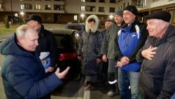 In this photo taken from video released by Russian TV Pool on Sunday, March 19, 2023, Russian President Vladimir Putin talks with local residents during his visit to Mariupol in Russian-controlled Donetsk region, Ukraine. Putin has traveled to Crimea to mark the ninth anniversary of the Black Sea peninsula's annexation from Ukraine.
