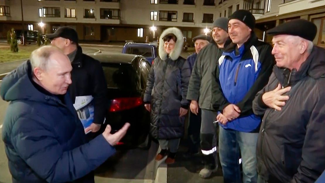 Putin talks with local residents during his visit to Mariupol.