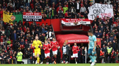 Manchester United fans display banners protesting about the owners of the club during the Premier League match between Manchester United and Southampton FC at Old Trafford on March 12, 2023 in Manchester, England. 