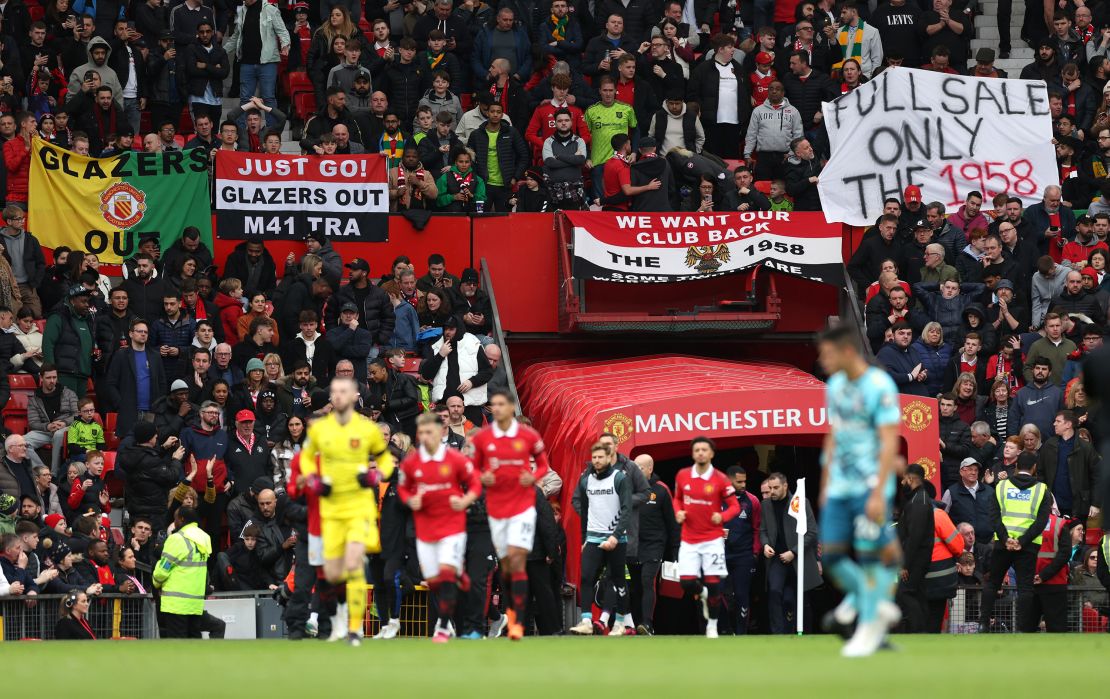 Manchester United fans display banners protesting about the current owners of the club earlier this month.
