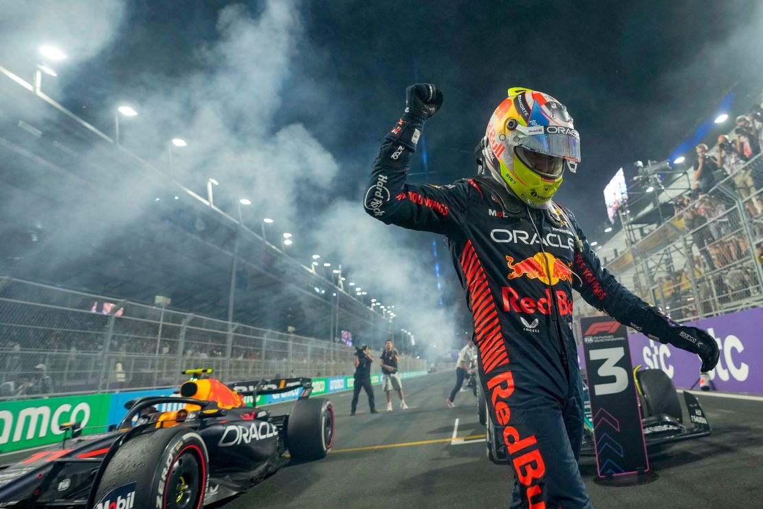 Red Bull Racing's Mexican driver Sergio Perez celebrates after winning the Saudi Arabia Formula One Grand Prix at the Jeddah Corniche Circuit in Jeddah on March 19, 2023. (Photo by Luca Bruno / POOL / AFP) (Photo by LUCA BRUNO/POOL/AFP via Getty Images)