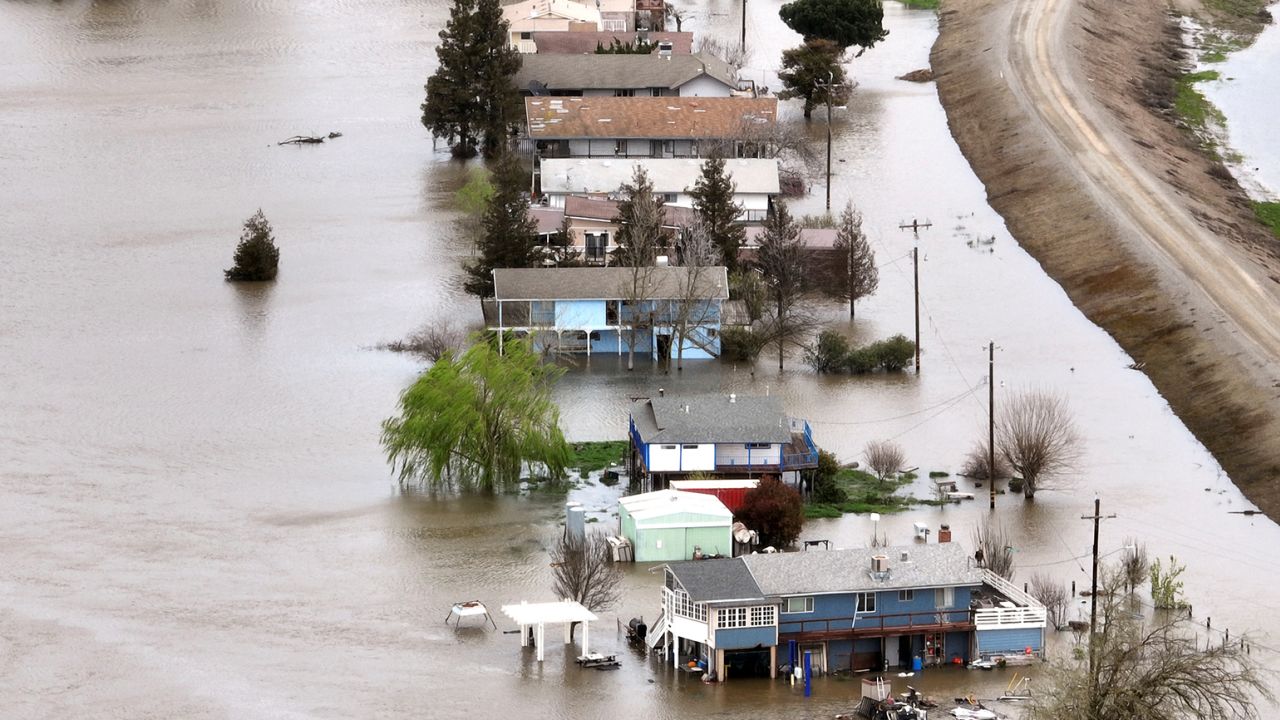Houses are partially submerged Sunday in Manteca, California, after heavy rain caused the San Joaquin River to spill over. 