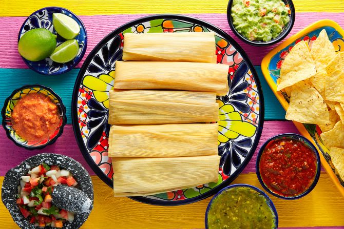 <strong>Tamales: </strong>A typical favorite dish prepared during Christmastime, tamales are just about as varied as the taco. A dab of masa is spread over a corn husk or banana leaf, then filled with proteins such as marinated pork or chicken.