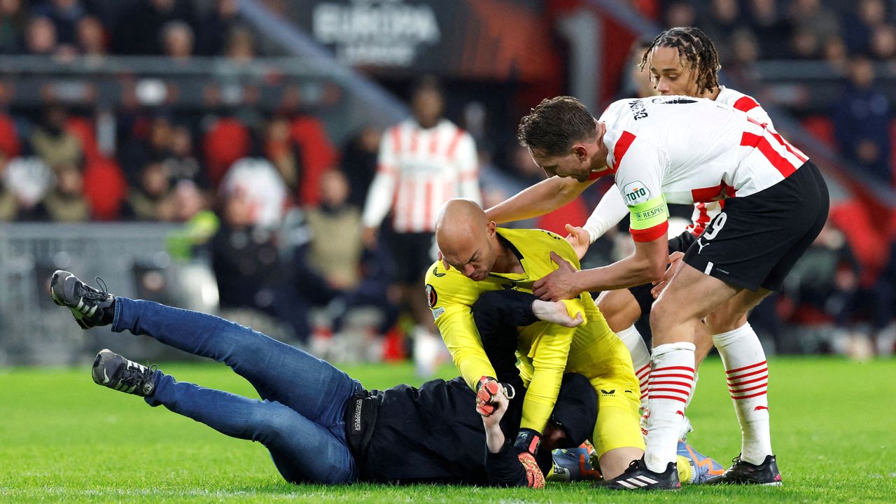 The pitch invader was promptly pinned to the ground by Dmitrović.