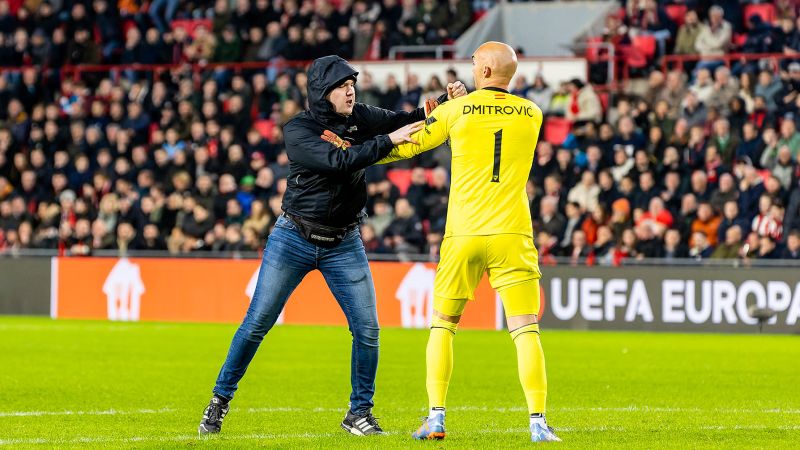 NextImg:PSV Eindhoven imposes 40-year stadium ban on fan who attacked goalkeeper | CNN