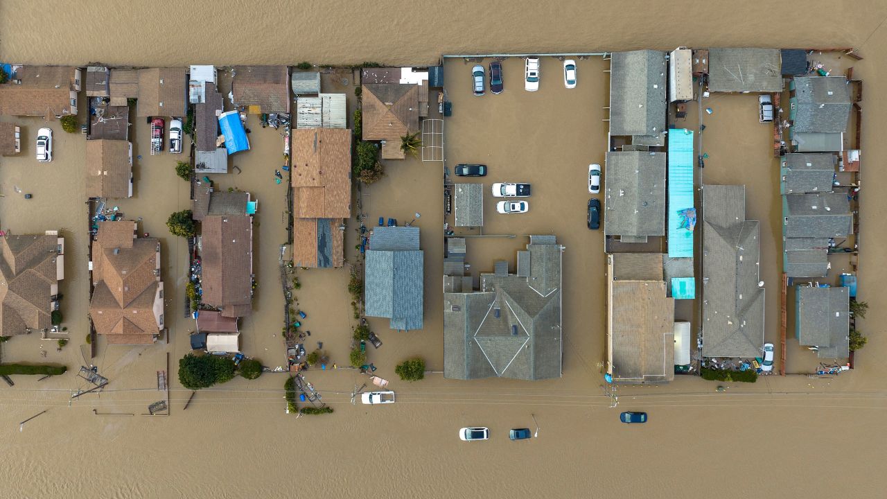 Vehicles and homes in floodwaters in Pajaro, California on March 11. Residents were forced to evacuate in the middle of the night after floodwaters broke through the Pajaro levee.