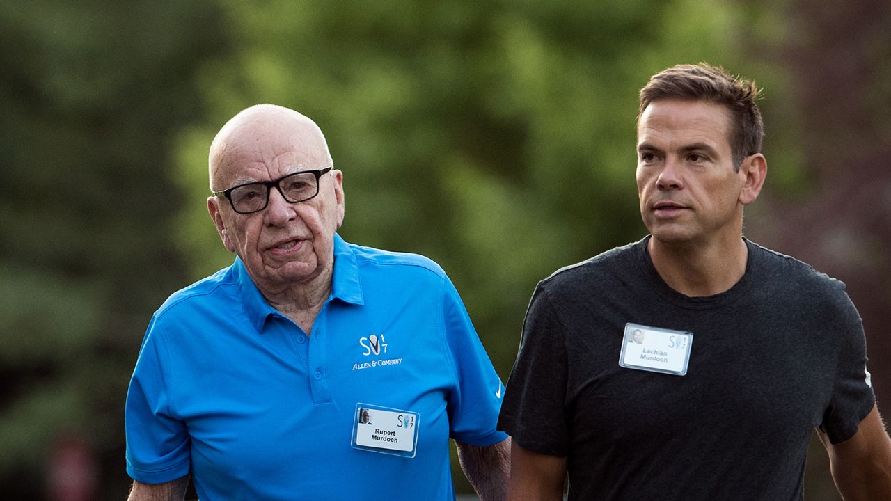 Rupert Murdoch, executive chairman of News Corp and chairman of Fox News, and Lachlan Murdoch, co-chairman of 21st Century Fox, walk together as they arrive on the third day of the annual Allen & Company Sun Valley Conference, July 13, 2017 in Sun Valley, Idaho. 