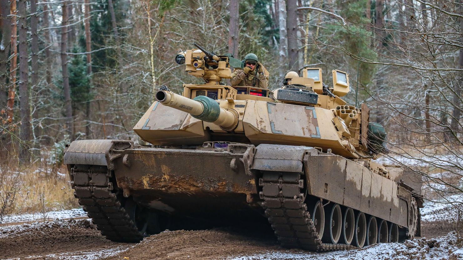 US Soldiers operate a M1A1 Abrams while conducting amphibious assault training during the Bull Run training exercise at Bemowo Piskie, Poland, November 25, 2022. 