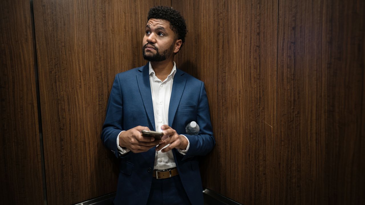 Maxwell Frost rides an elevator on his way to be interviewed on a podcast in Orlando, Florida, on August 30, 2022.