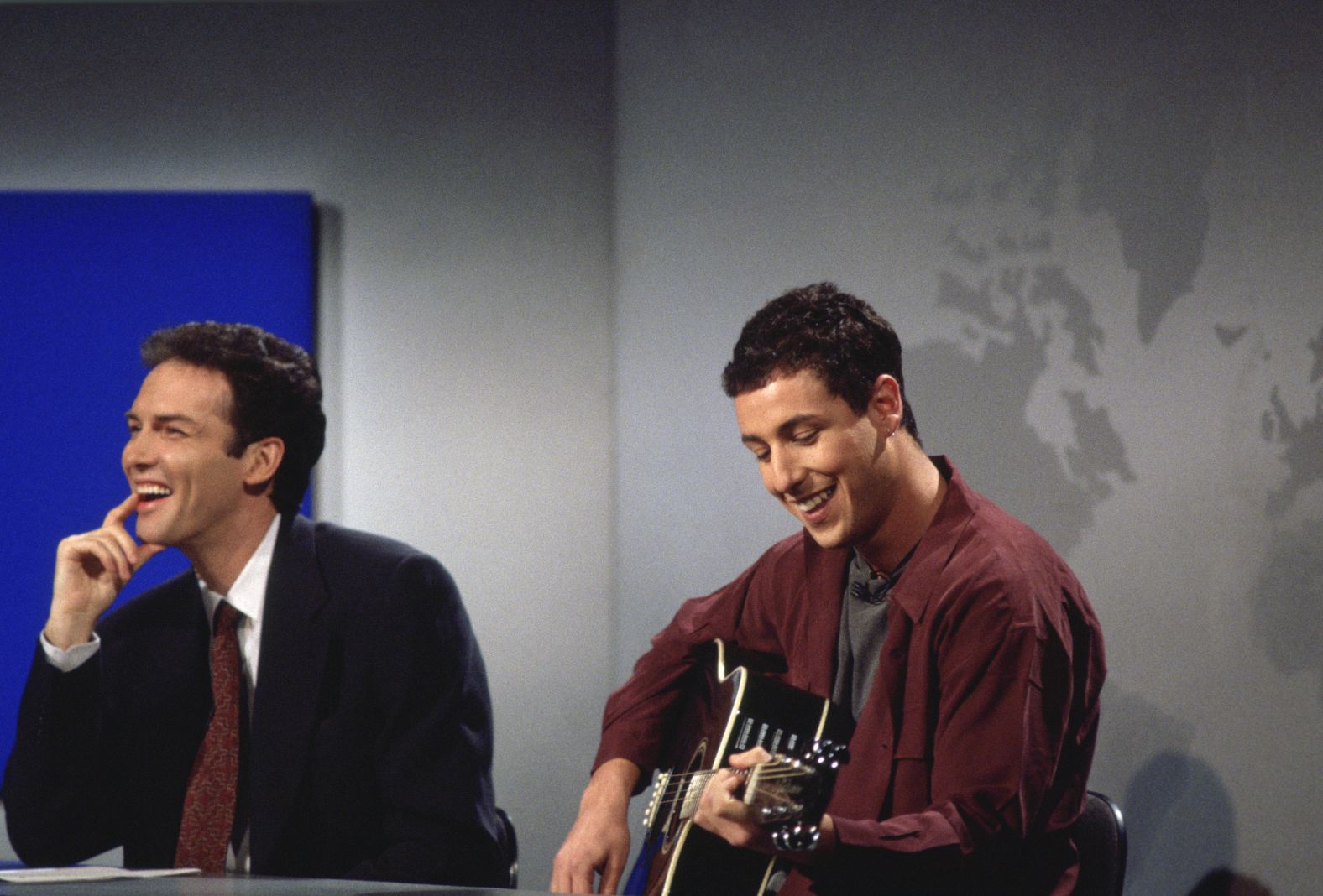 Sandler, next to Norm Macdonald, plays "The Chanukah Song" during an "SNL" episode in 1994. The comedic song, which talks about Hanukkah and famous people who are (and are not) Jewish, would later go on to be released as a single. It was certified gold.