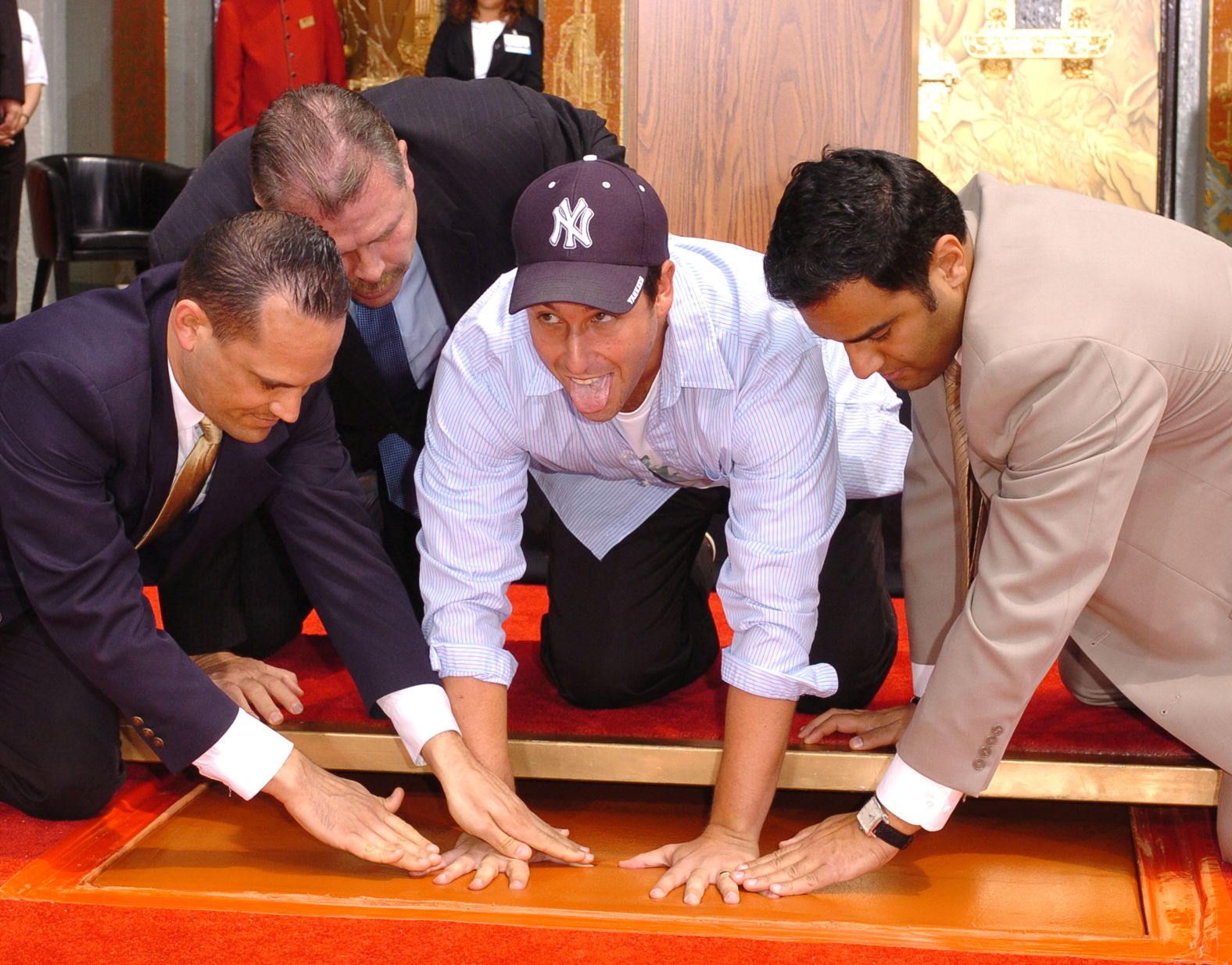 Sandler leaves his handprints at the famous Grauman's Chinese Theatre in Hollywood in May 2005.