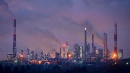 Flue gas and steam rise out of chimneys and smokestacks of an oil refinery during sunset on a frosty day in the Siberian city of Omsk, Russia, February 8, 2023.