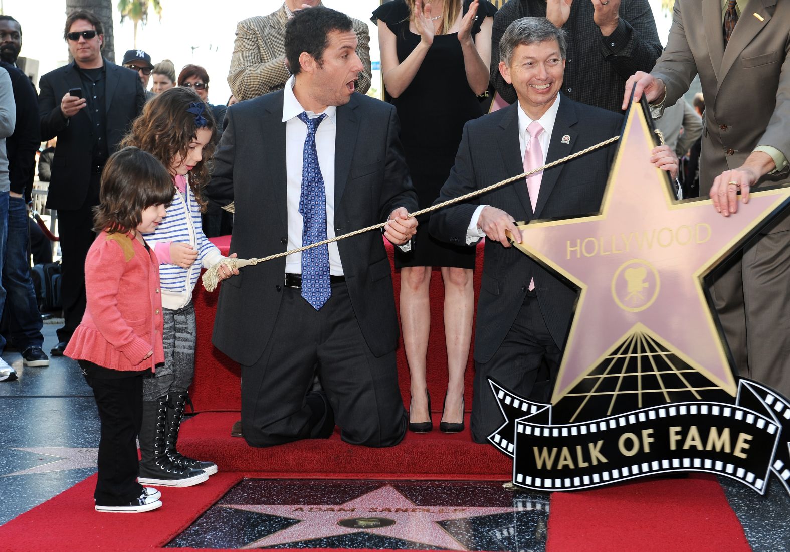 Sandler is joined by his daughters, Sunny and Sadie, as he is honored with a star on the Hollywood Walk of Fame in 2011.