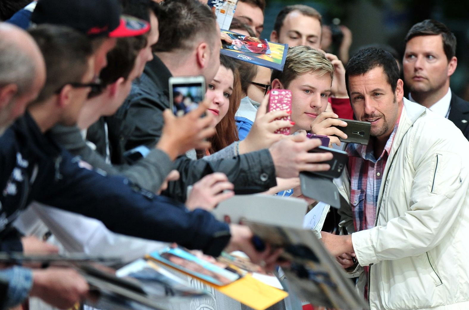 Sandler greets fans in Berlin at the premiere of the film "Blended" in 2014.