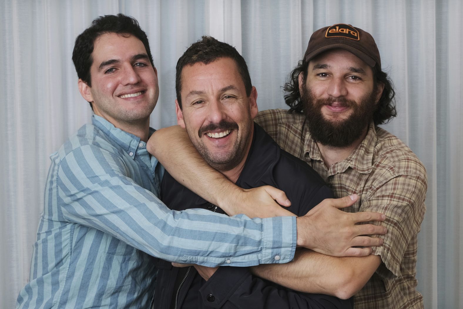 Sandler poses for a portrait with his "Uncut Gems" co-directors Benny and Josh Safdie in September 2019. Sandler received critical acclaim for his performance and later won the Independent Spirit Award for best male lead. 