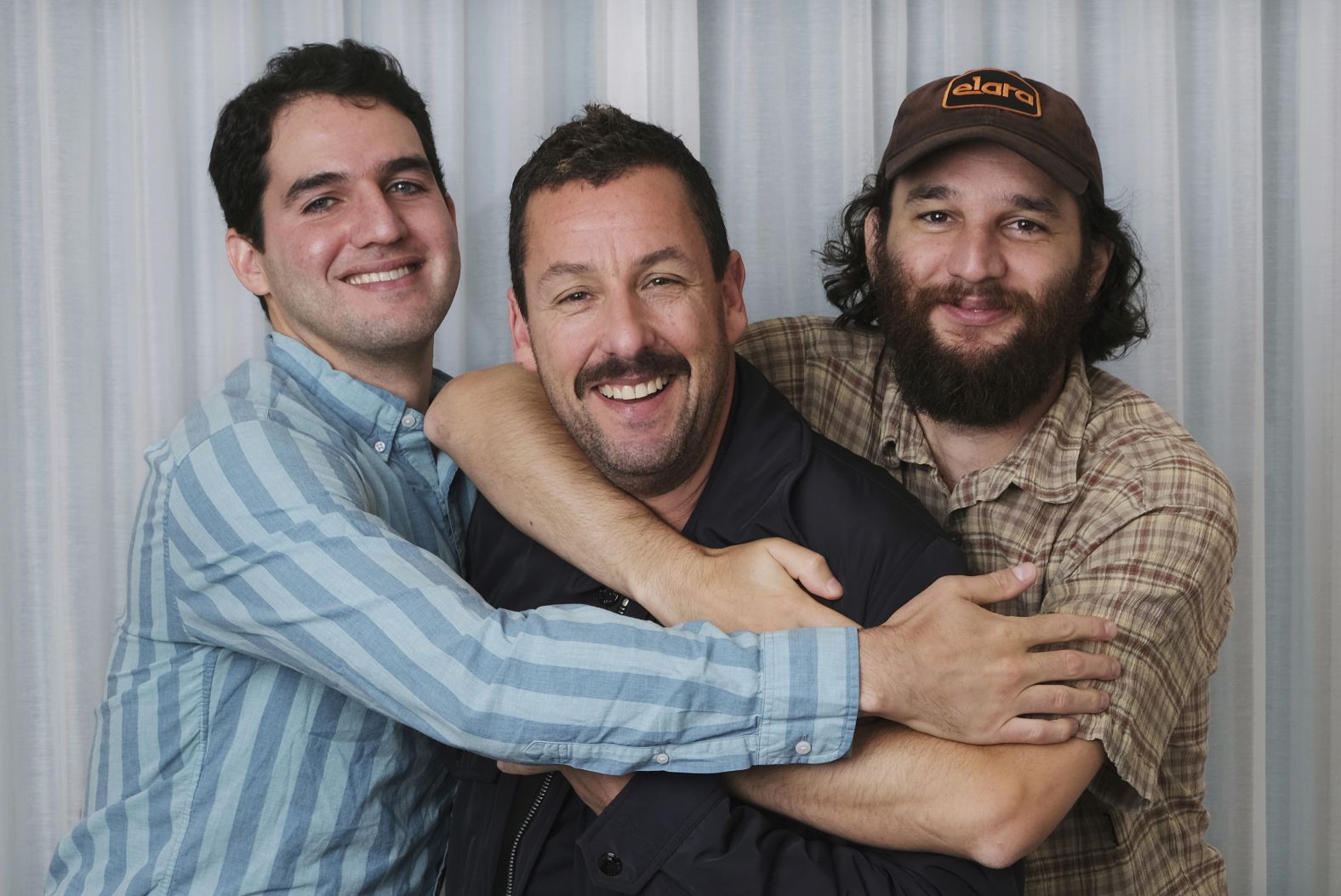 Sandler poses for a portrait with his "Uncut Gems" co-directors Benny and Josh Safdie in September 2019. Sandler received critical acclaim for his performance and later won the Independent Spirit Award for best male lead.