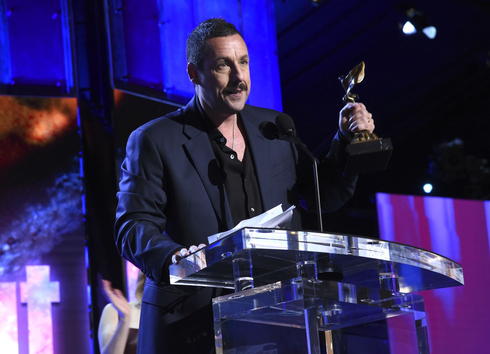 Sandler accepts his Independent Spirit Award in 2020.