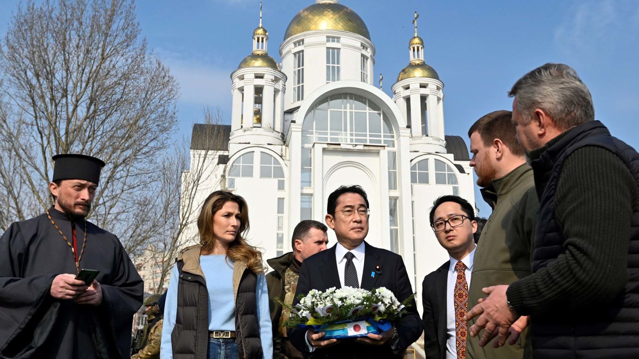 Japan's Prime Minister Fumio Kishida (center) pictured outside a church in Bucha, Ukraine, on March 21.