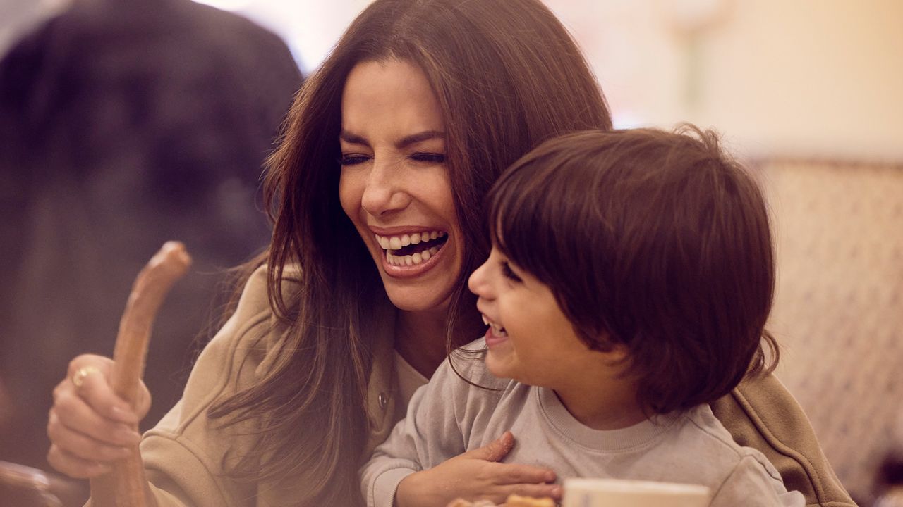Longoria and her 4-year-old son, Santiago, enjoy churros during the filming of