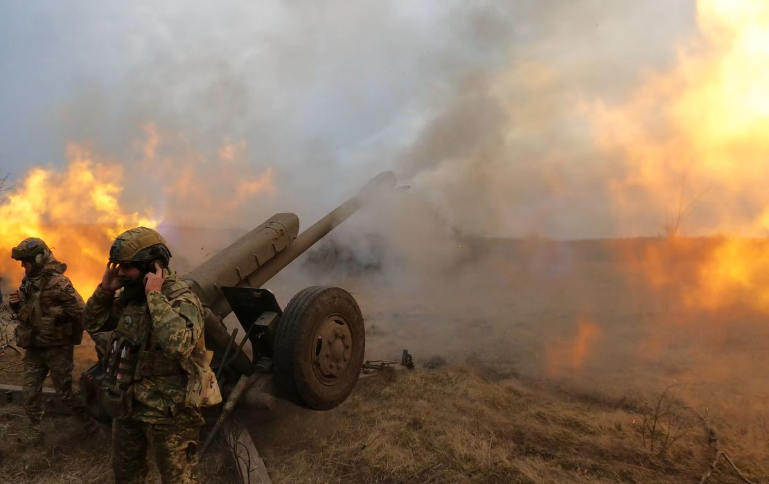 Ukrainian troops fire a D-30 howitzer at Russian positions near Bakhmut, where heavy fighting has taken place for weeks.