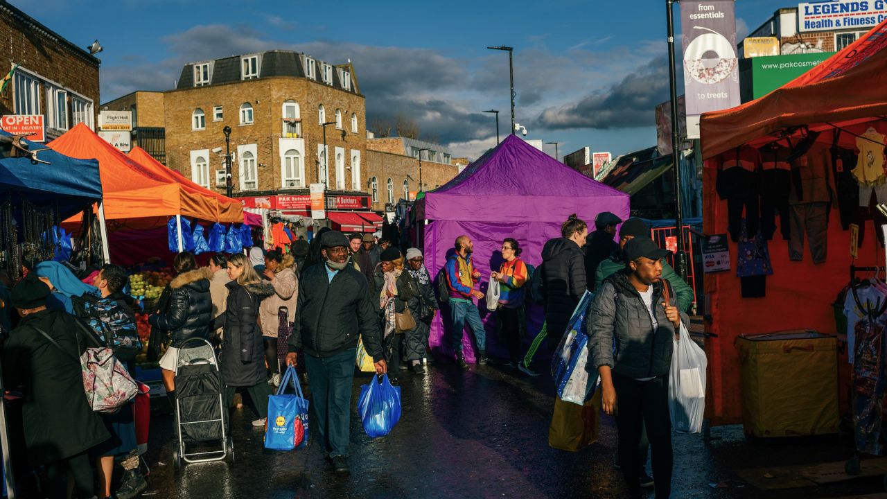 Shoppers browse stalls at Ridley Road Market in the Hackney district of London on March 18, 2023.