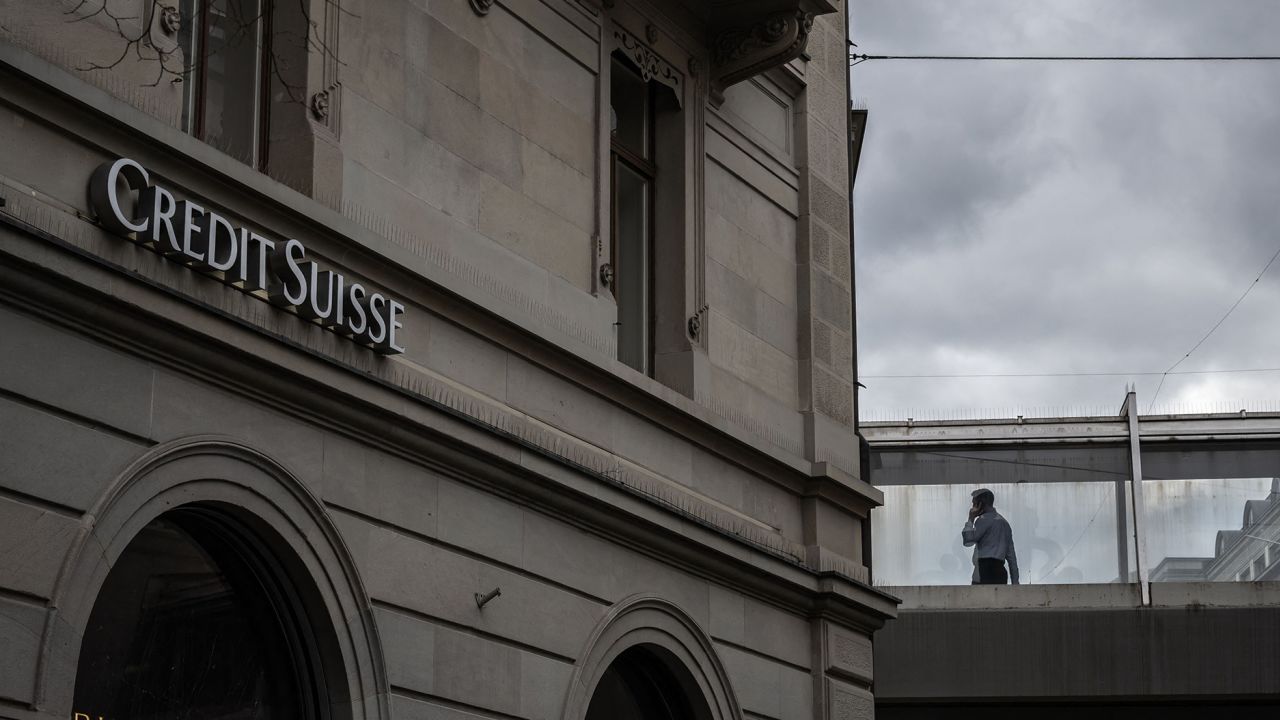 A person talks on the phone at the Credit Suisse bank headquarters in Zurich on March 20, 2023. 