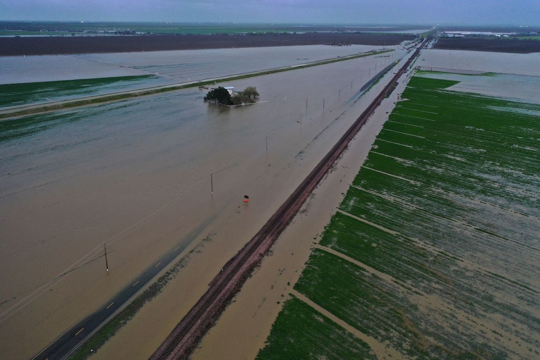 An aerial image shows flooded roads and Central Valley farmland Tuesday near Corcoran, California.