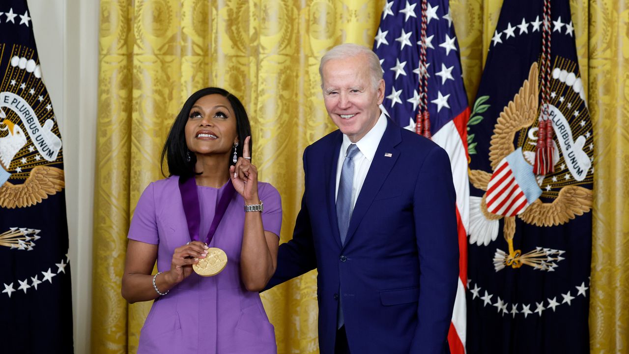 President Joe Biden awards actress Mindy Kaling a 2021 National Medal of Art during a ceremony in the East Room of the White House on March 21, 2023 in Washington, DC.