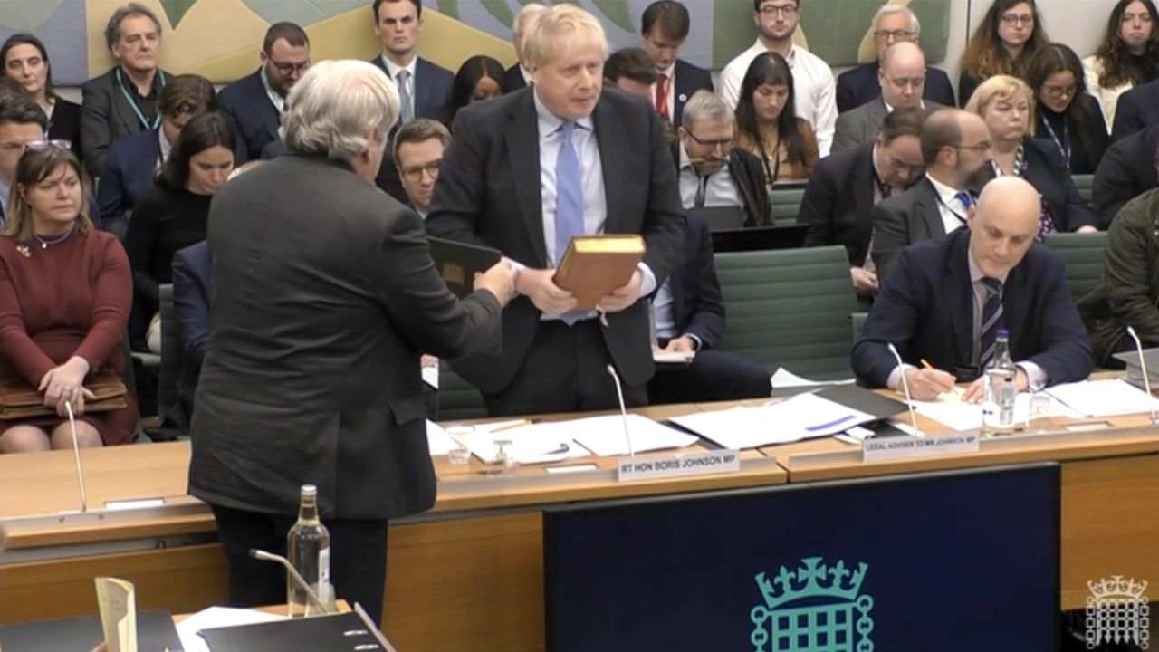 Johnson took an oath on a Bible before giving evidence.
