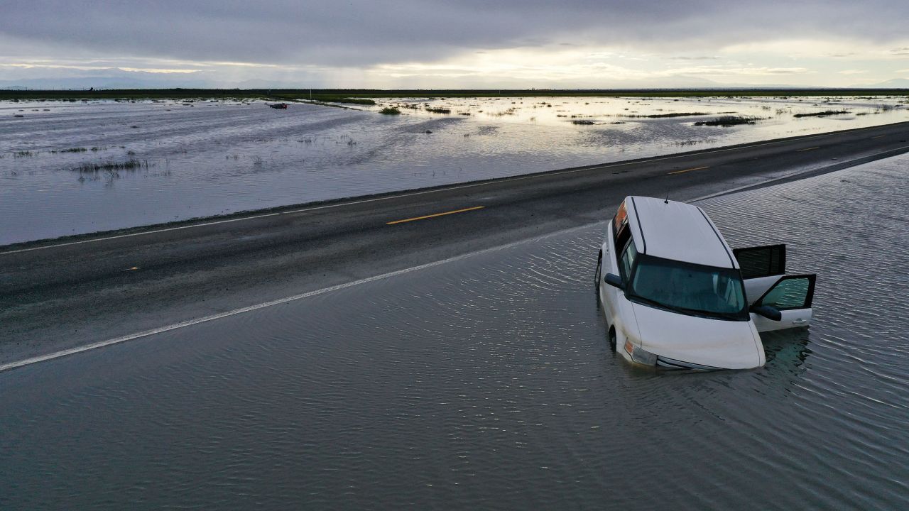 A vehicle submerges in flood waters in the Central Valley on March 22, 2023. 