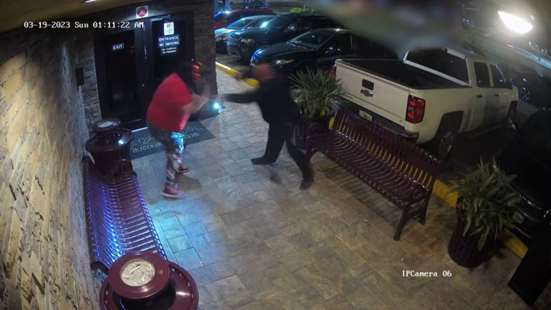 Strip club bouncers fight off, disarm masked man with a gun | CNN