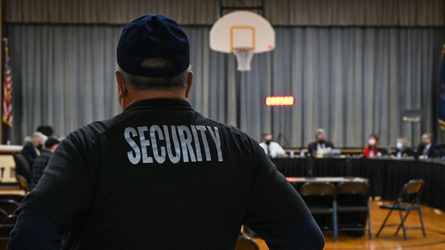 A Pennsbury School District security guard observes a Pennsbury School Board meeting in Levittown, Pennsylvania on December 16, 2021.