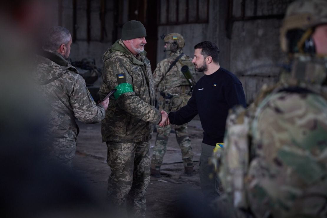 Ukrainian President Volodymyr Zelenskyy shakes hands with a Ukrainian soldier during his visit to the Bakhmut frontline in Donetsk region, Ukraine on March 22.