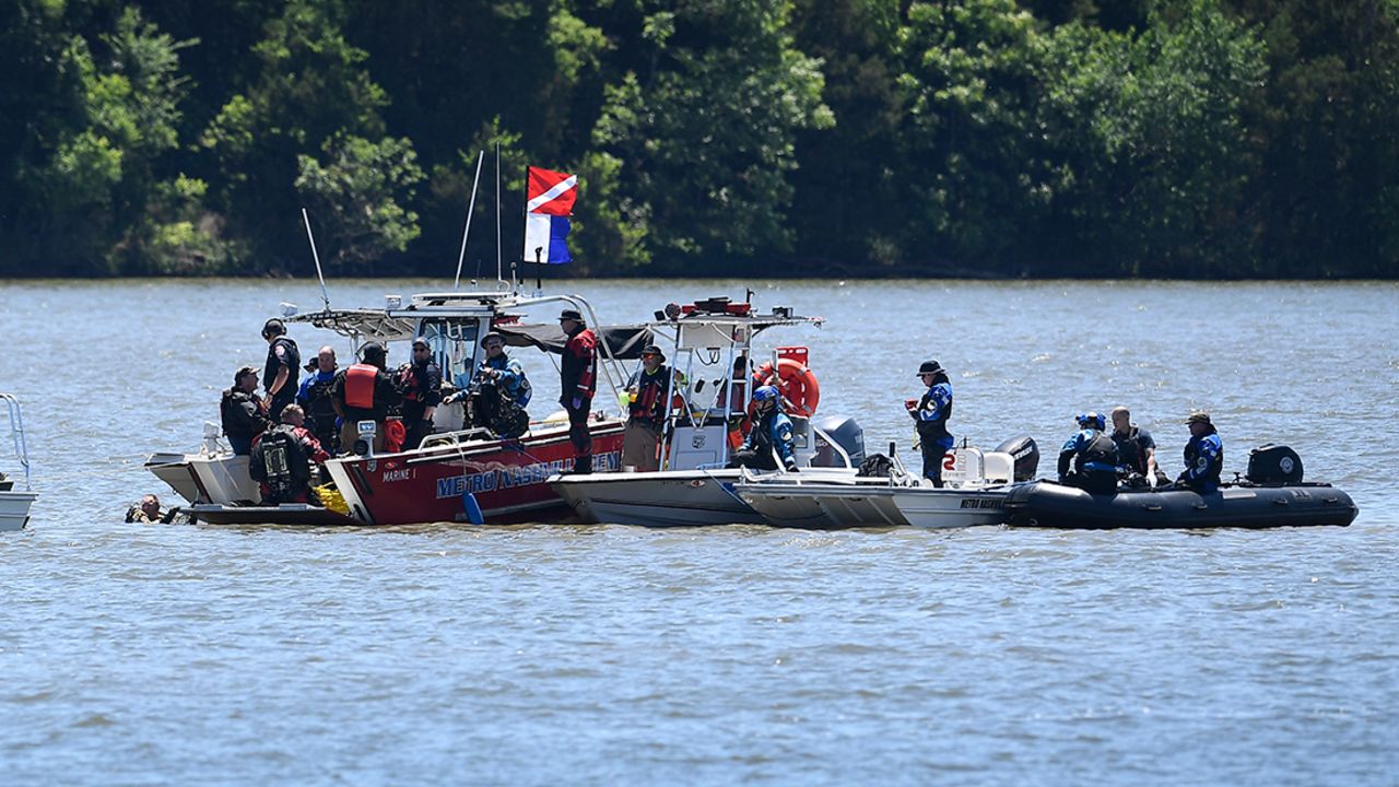 Emergency personnel remove debris from a plane crash in Percy Priest Lake Sunday, May 30, 2021. 