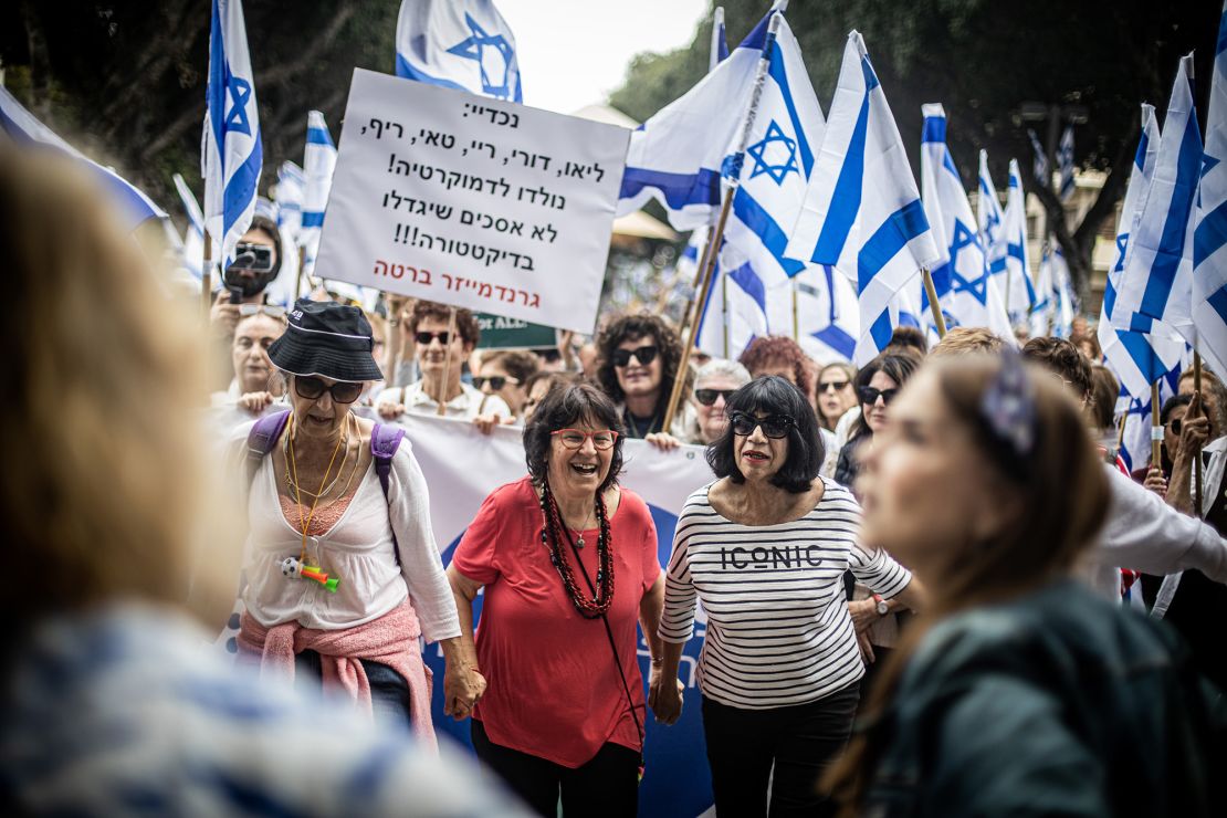 Women dance during protests against Netanyahu's contentious judicial reforms in Tel Aviv on March 22, 2023.