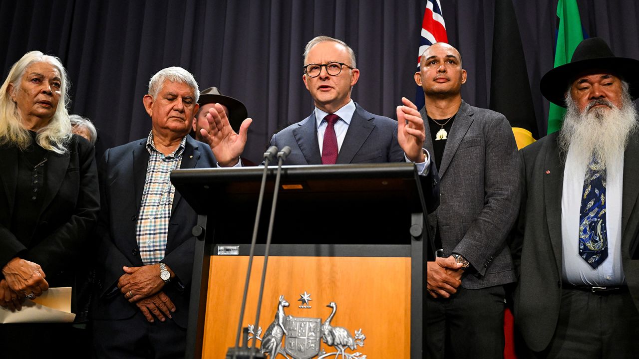 Australian Prime Minister Anthony Albanese, surrounded by members of the First Nations Referendum Working Group, during a news conference at Parliament House in Canberra, March 23, 2023.
