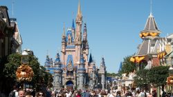 Visitors walk along Main Street at The Magic Kingdom as Walt Disney World reopens following Hurricane Ian on September 30, 2022 in Orlando, Florida.