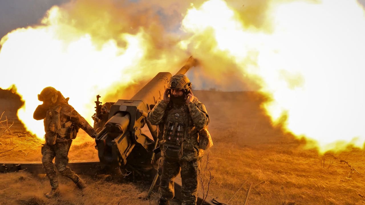 Ukrainian servicemen fire with a D-30 howitzer at Russian positions near Bakhmut, eastern Ukraine, on March 21, 2023.