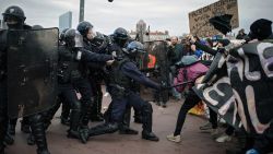 Protesters clash with police officers during a demonstration in Lyon, central France, Thursday, March 23, 2023. French unions are holding their first mass demonstrations Thursday since President Emmanuel Macron enflamed public anger by forcing a higher retirement age through parliament without a vote. (AP Photo/Laurent Cipriani)