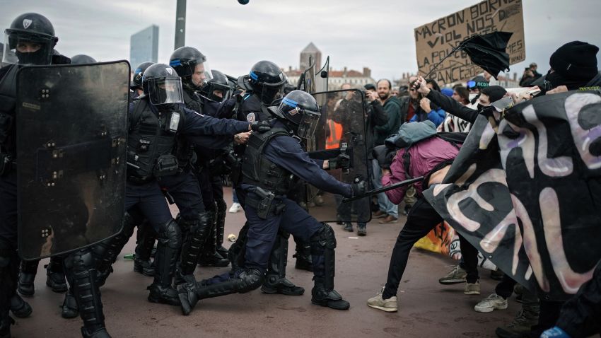 Protesters clash with police officers during a demonstration in Lyon, central France, Thursday, March 23, 2023. French unions are holding their first mass demonstrations Thursday since President Emmanuel Macron enflamed public anger by forcing a higher retirement age through parliament without a vote. (AP Photo/Laurent Cipriani)