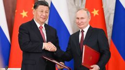 Chinese leader Xi Jinping and Russian President Vladimir Putin shake hands after signing joint statement during Xi's state visit to Moscow in March 2023. 