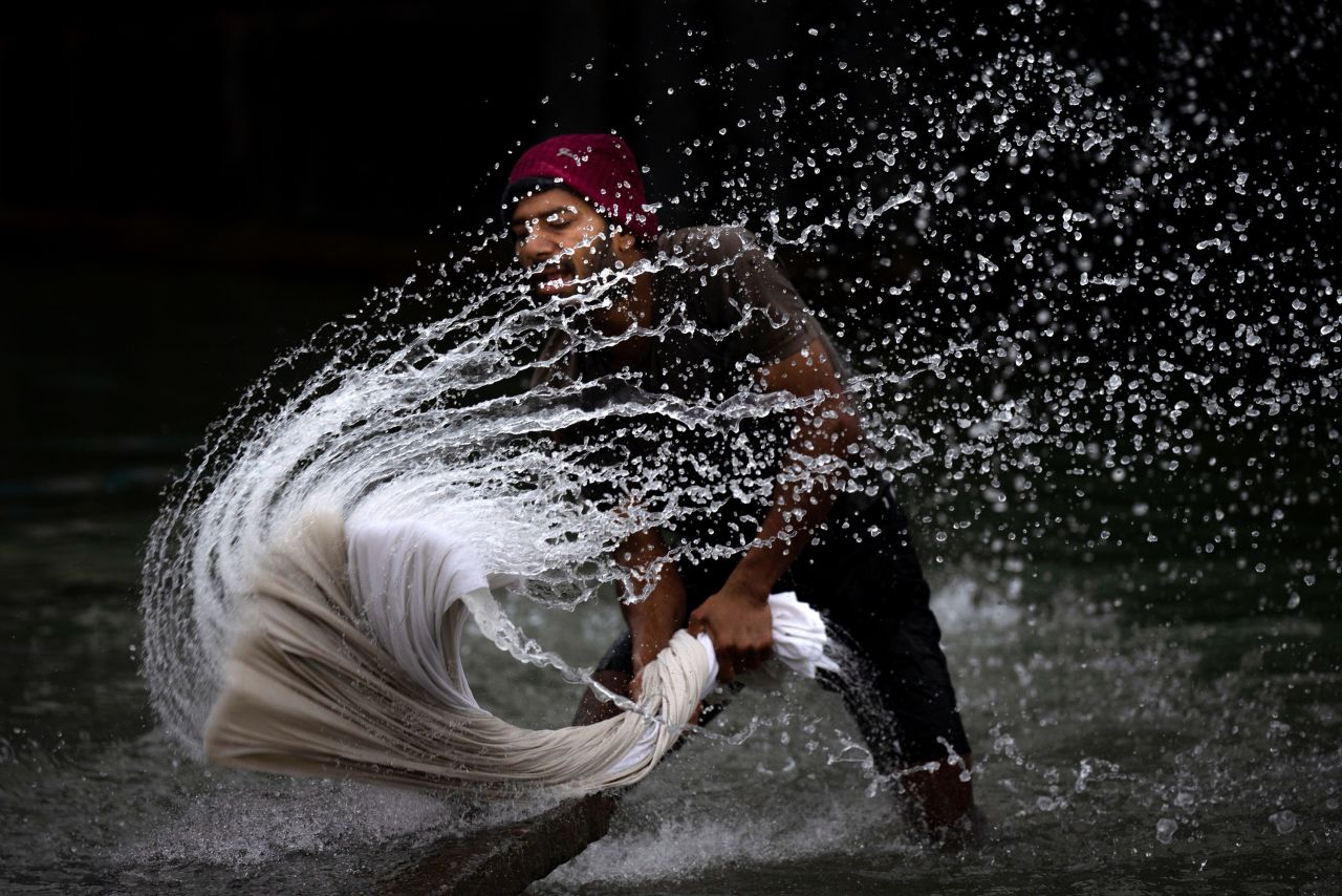 A man washes clothes on the banks of the Brahmaputra river in Guwahati, India, on Wednesday, March 22.