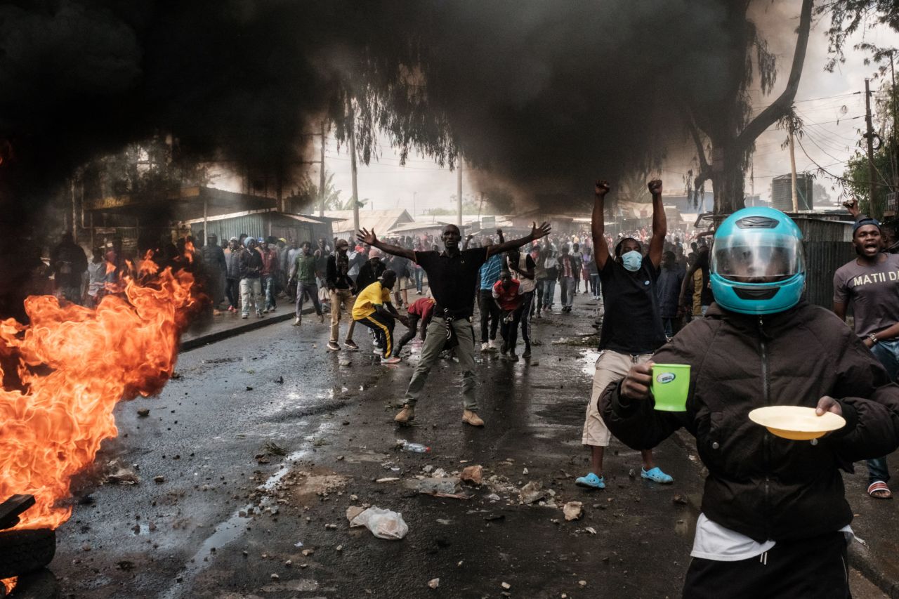 Protesters gesture toward police officers during a rally in Nairobi, Kenya, on Monday, March 20. Raila Odinga, the country's opposition leader and former prime minister, <a href="https://www.cnn.com/2023/03/20/africa/kenya-anti-government-protests-intl/index.html" target="_blank">has called for weekly nationwide protests</a> against the high cost of living.