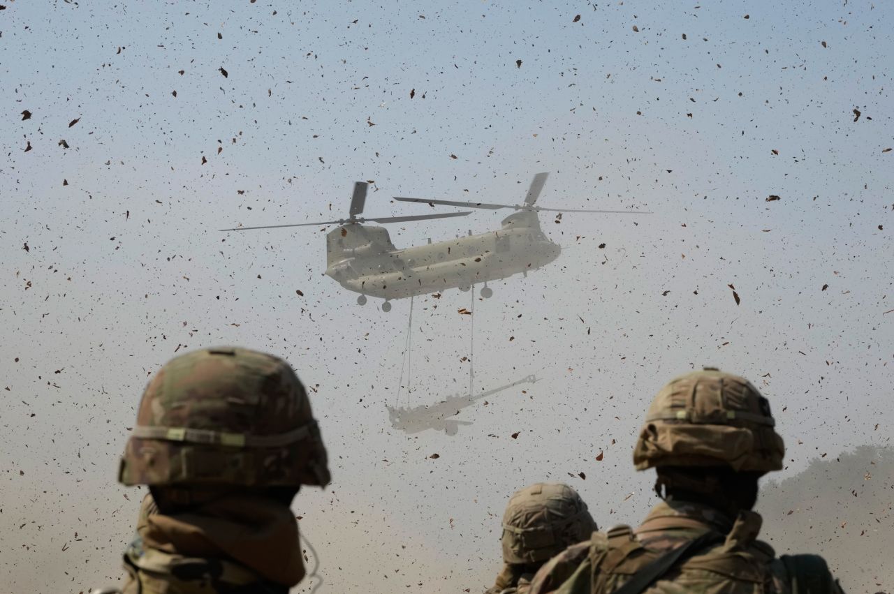A US Army helicopter transports a howitzer during a <a href="https://www.cnn.com/2023/03/18/asia/north-korea-ballistic-missile-launch-19-march-intl-hnk/index.html" target="_blank">joint military drill</a> in Pocheon, South Korea, on Sunday, March 19.