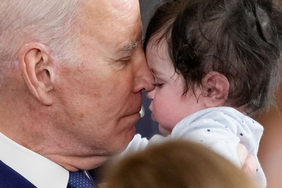 US President Joe Biden holds Hodge, the son of US Rep. Jimmy Gomez, after speaking at a White House event on Thursday, March 23.