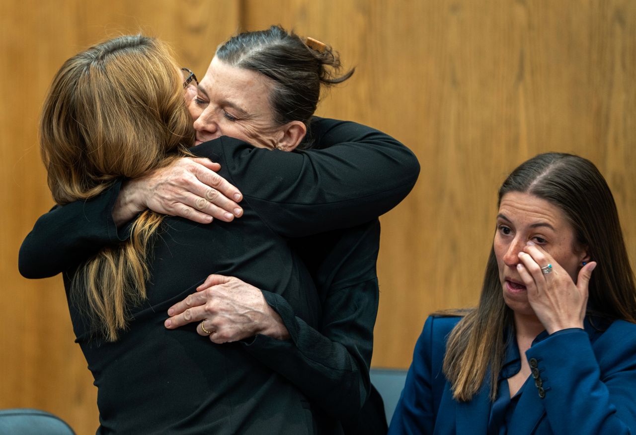 Dr. Giovannina Anthony, second from left, hugs her attorney after a Wyoming district court judge <a href="https://www.cnn.com/2023/03/22/us/wyoming-abortion-ban-restraining-order" target="_blank">temporarily blocked a state abortion ban</a> on Wednesday, March 22. Anthony, an OB-GYN, was a plaintiff in a lawsuit challenging the ban.