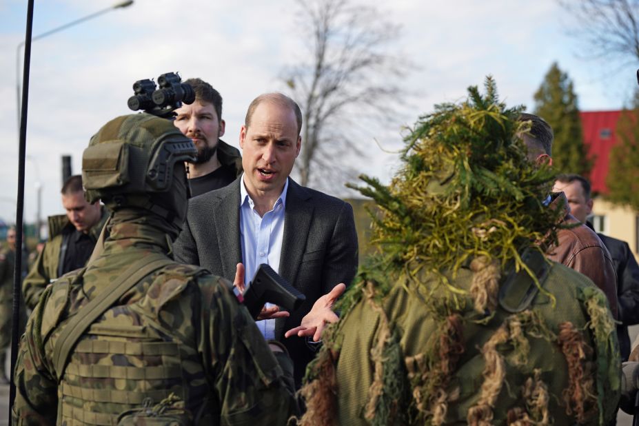 Britain's Prince William meets with members of the Polish military while making <a href="https://www.cnn.com/2023/03/22/europe/prince-william-poland-intl-gbr/index.html" target="_blank">an unannounced trip to a military base near the Ukrainian-Polish border</a> on Wednesday, March 22. He also met with British troops stationed there, praising both groups for their "cooperation in the support of the people of Ukraine and their freedom."